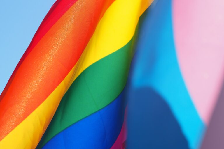 JMR Featured in Lavender Magazine rainbow flag, JMR featured in LGBTQIA+ publication Lavender Magazine